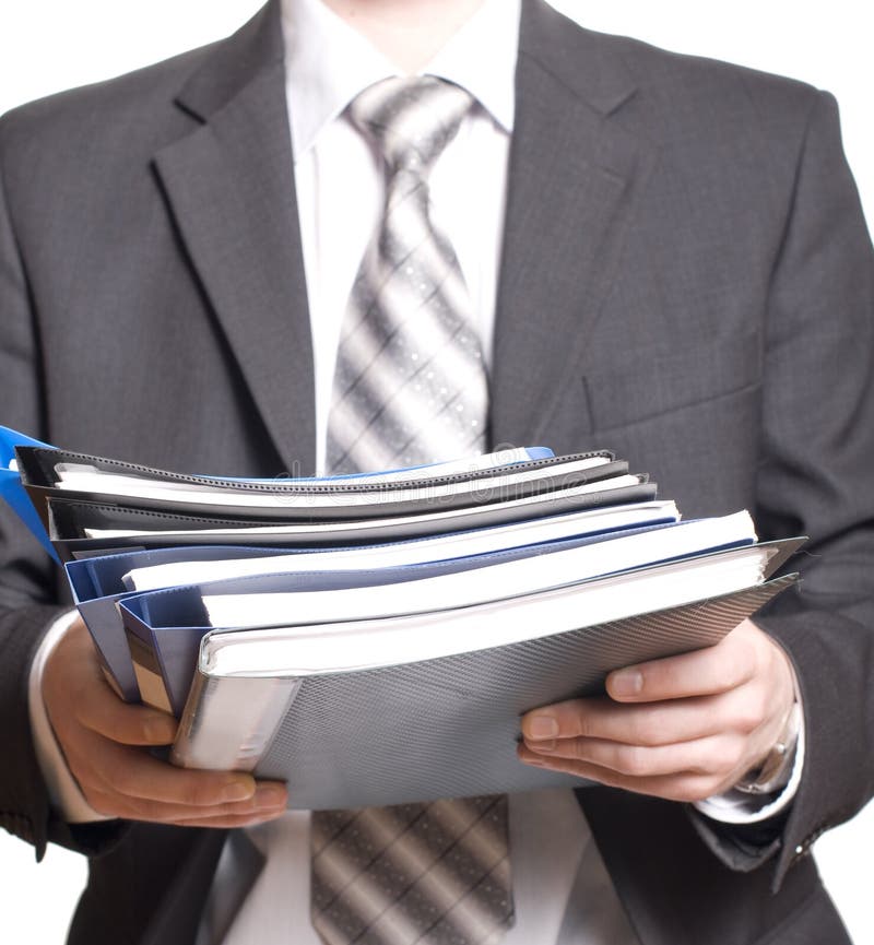 Business man holding stack of files and folders. Business man holding stack of files and folders