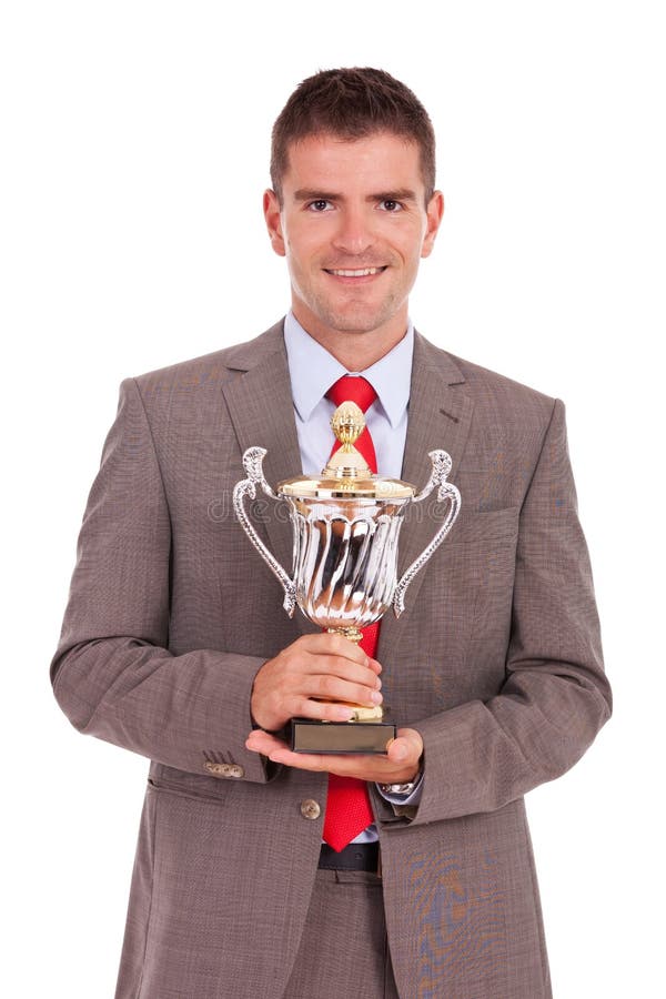 Business Man Holding His Trophy Stock Photo - Image: 27572826