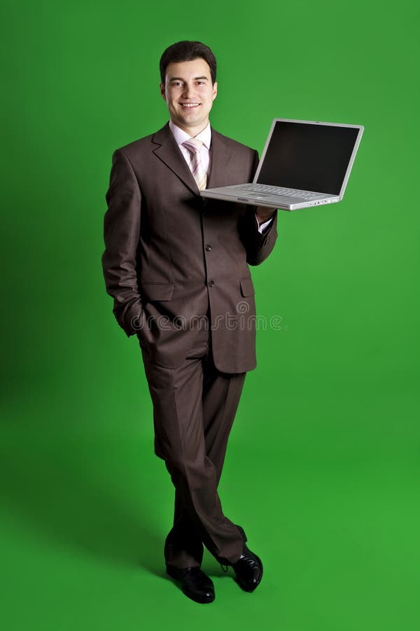 Business man holding laptop stock photo