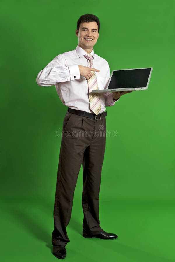 Business man holding laptop royalty free stock photo