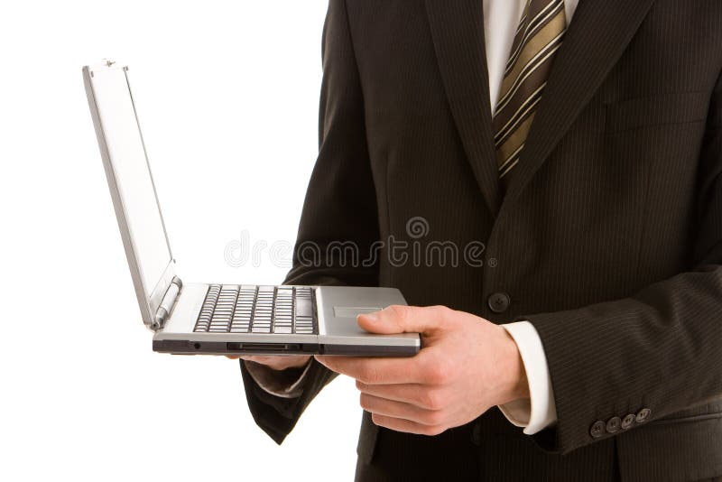 A business man holding a silver laptop royalty free stock images