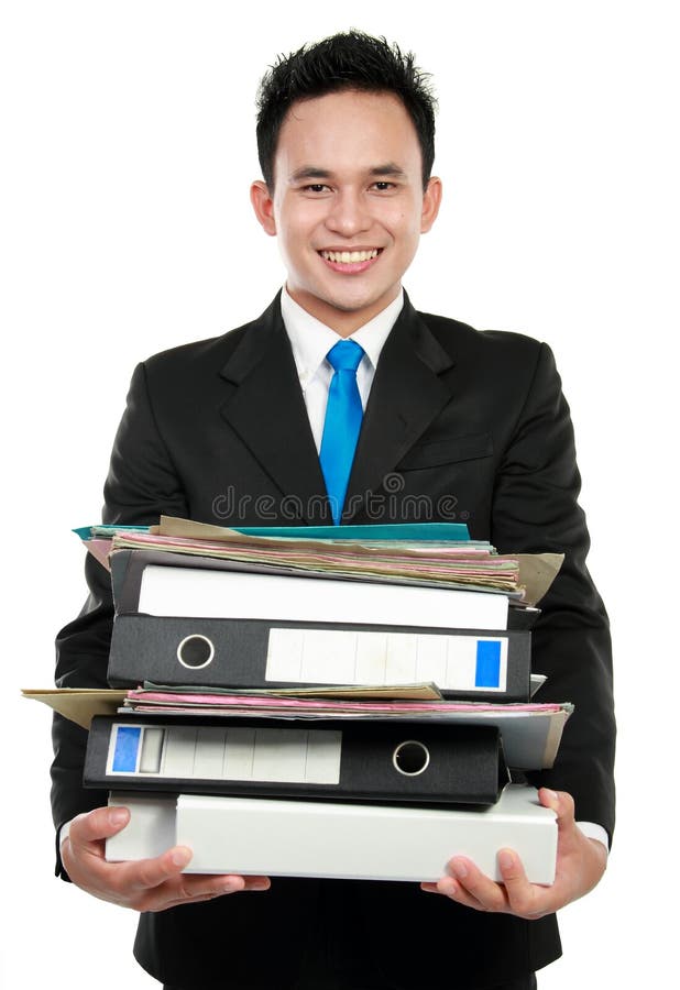 Smiling business man holding stack of files and folders isolated against white background