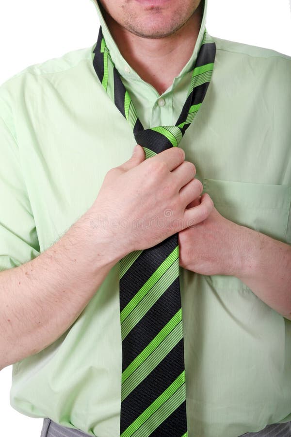 Business Man knotting tie