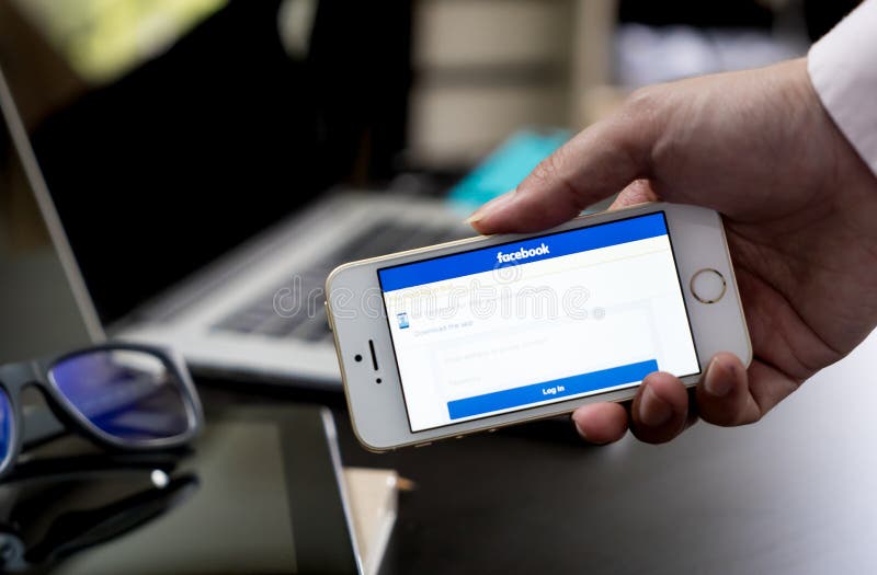 businessman show Facebook login page on his smartphone for using phone  social app for business. 3 August 2018,Bangkok, Thailand Stock Photo - Alamy