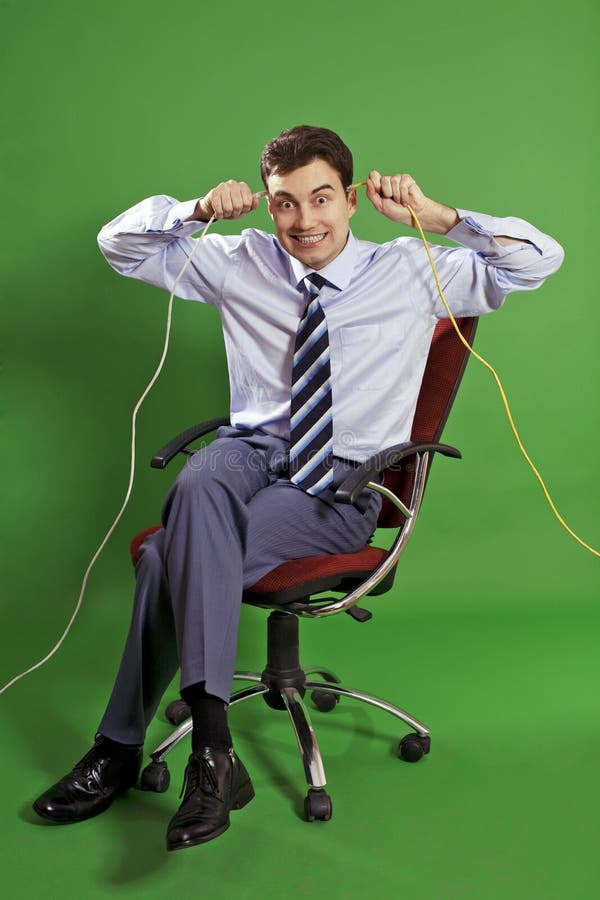 Business man making faces stock photo