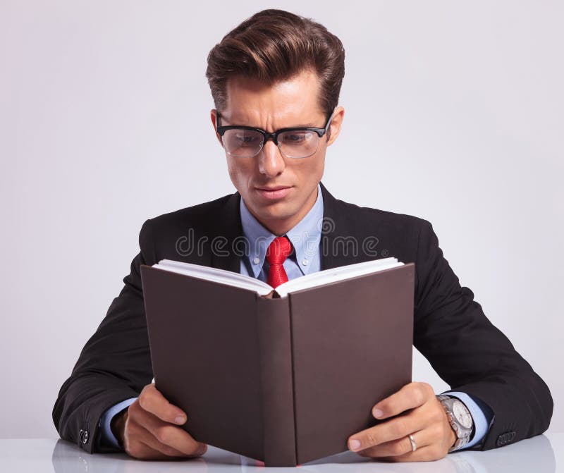 Business Man Reading Book At His Desk Stock Image Image