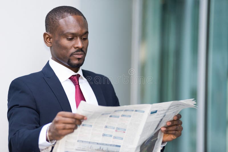 Business man reading a newspaper