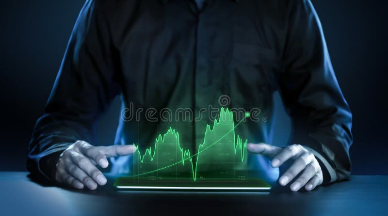 Business man showing profitable stock market holographic technology graphs in modern work background for the future. Company stock photography Business man showing profitable stock market holographic technology graphs in modern work background for the future. Company stock photography