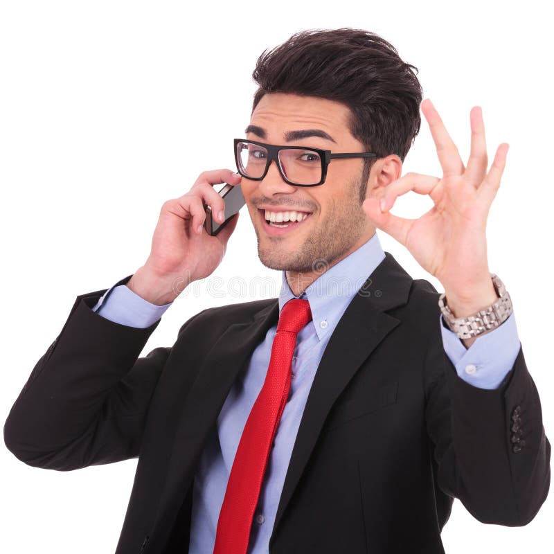 Business man shows ok sign on phone