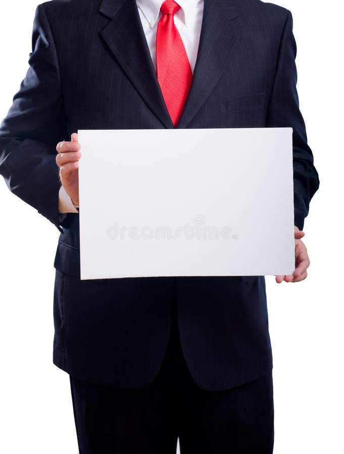 A business man or politician in a blue suit and necktie with a white sign on a white background with copy space. A business man or politician in a blue suit and necktie with a white sign on a white background with copy space
