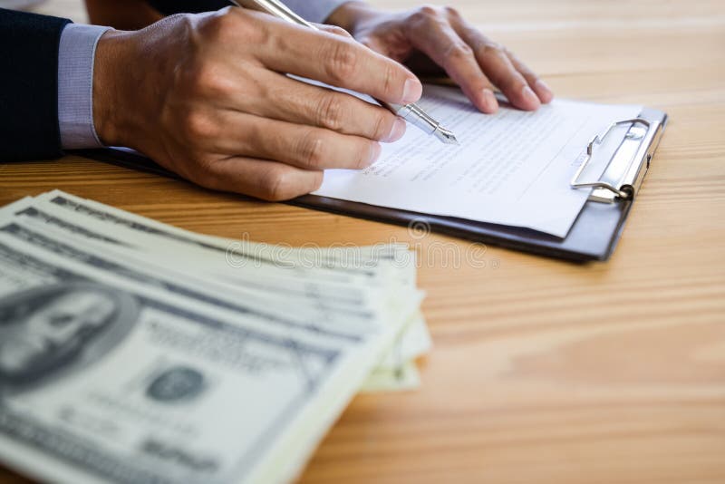 Business man signing a contract. Owns the business sign personally,director of the company, solicitor. Real estate agent holding stock images Business man signing a contract. Owns the business sign personally,director of the company, solicitor. Real estate agent holding stock images