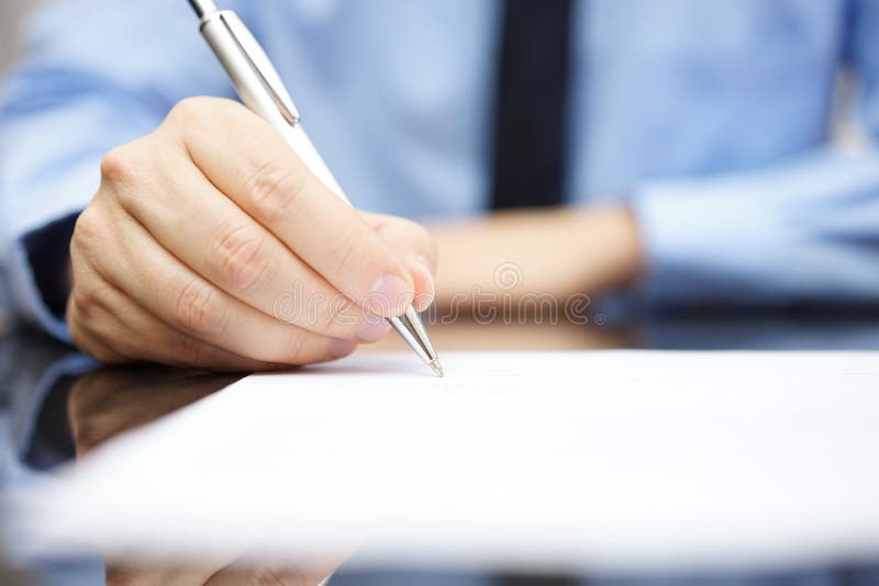 Business man signing the contract to finalize a deal. Negotiating table stock images, royalty-free photos and pictures
