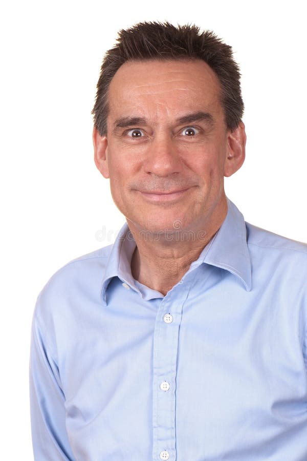Business Man with Silly Smile and Funny Face. Attractive Middle Age Man in Blue Shirt with Silly Smile and Funny Expression stock photo Business Man with Silly Smile and Funny Face. Attractive Middle Age Man in Blue Shirt with Silly Smile and Funny Expression stock photo