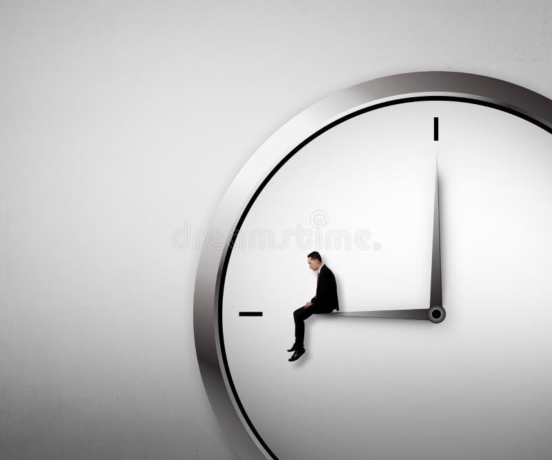 Business man sitting on the clock stock image Business man sitting on the clock stock image