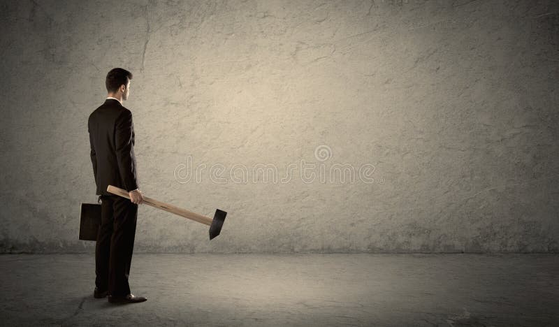 Man hitting wall with sledgehammer hi-res stock photography and