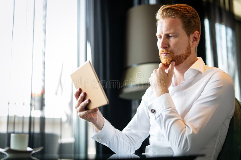 Business man with tablet, technology or corporate communication. Internet, networking professional stock image
