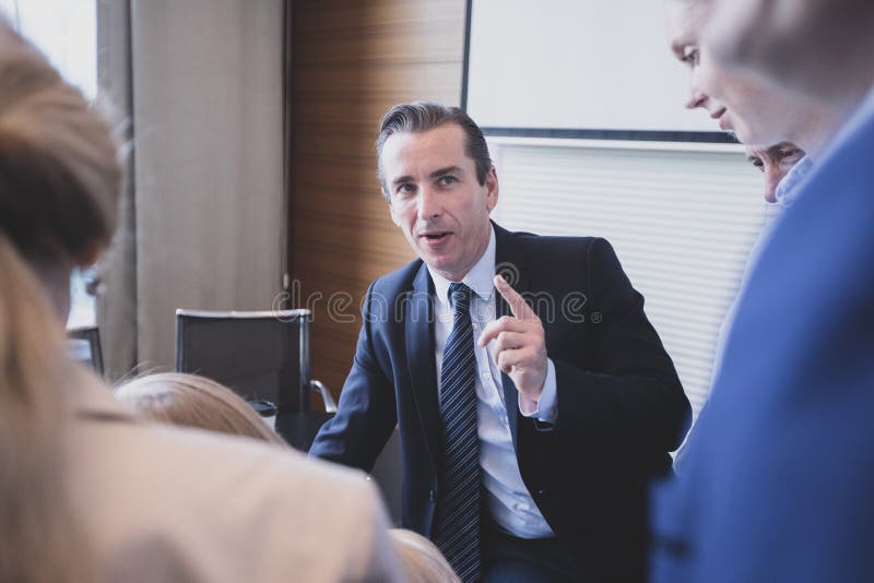 Business Man Talking To His Colleagues Stock Photo - Image of education ...