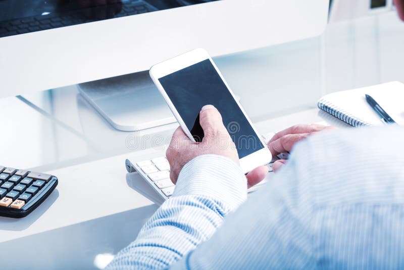 Business man typing on mobile device, office enviroment stock photos Business man typing on mobile device, office enviroment stock photos