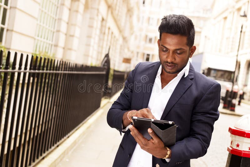 Business man using tablet stock photos Business man using tablet stock photos