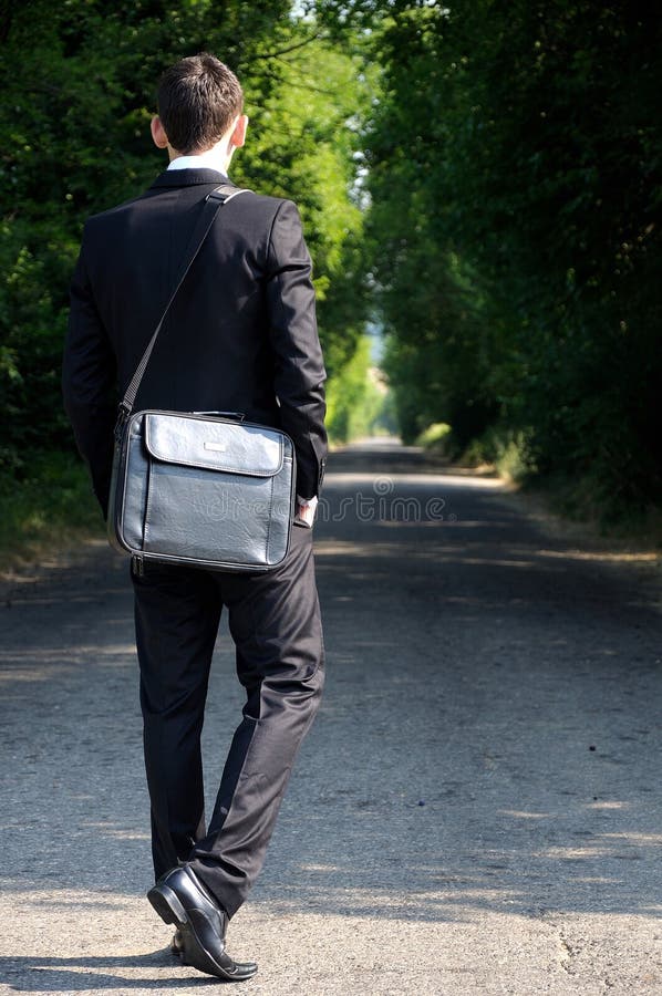 Business man walking stock photo