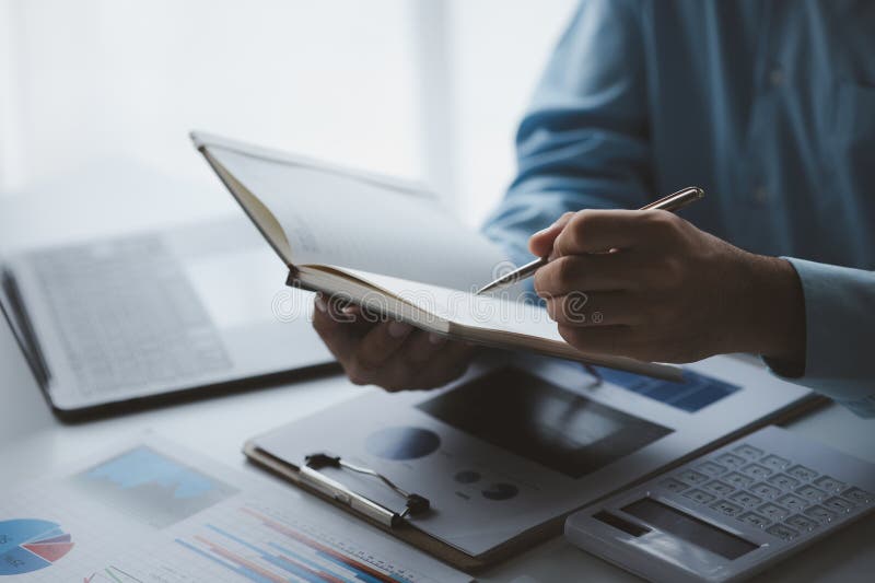 Business man writing a message on an empty notebook, taking memos in a notebook, taking important messages, writing a daily diary royalty free stock images