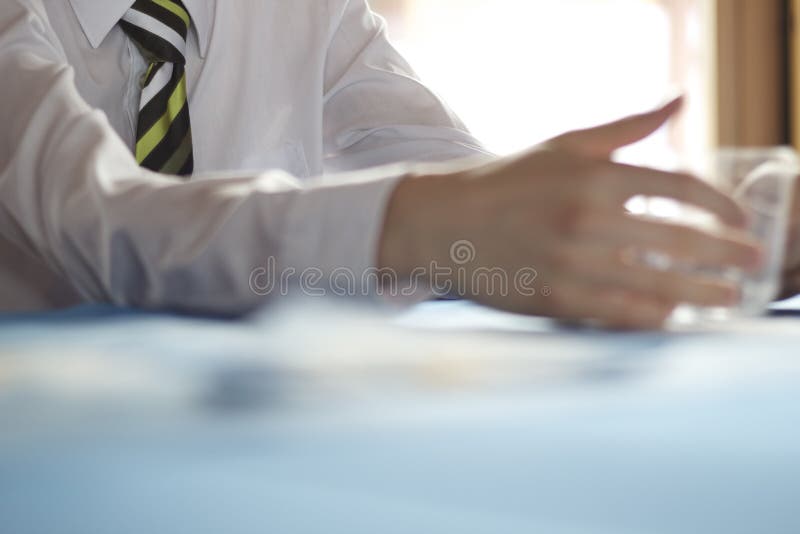 Business meeting going on. Mans arm at negotiation table. Negotiating table stock images, royalty-free photos and pictures