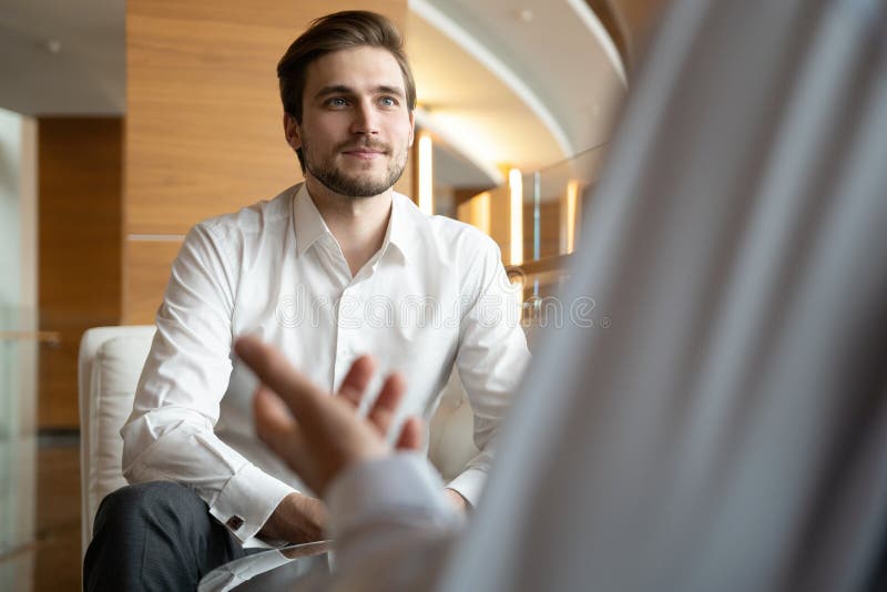 Business Meeting Two Business People Sitting In Front Of Each Other In The Office While