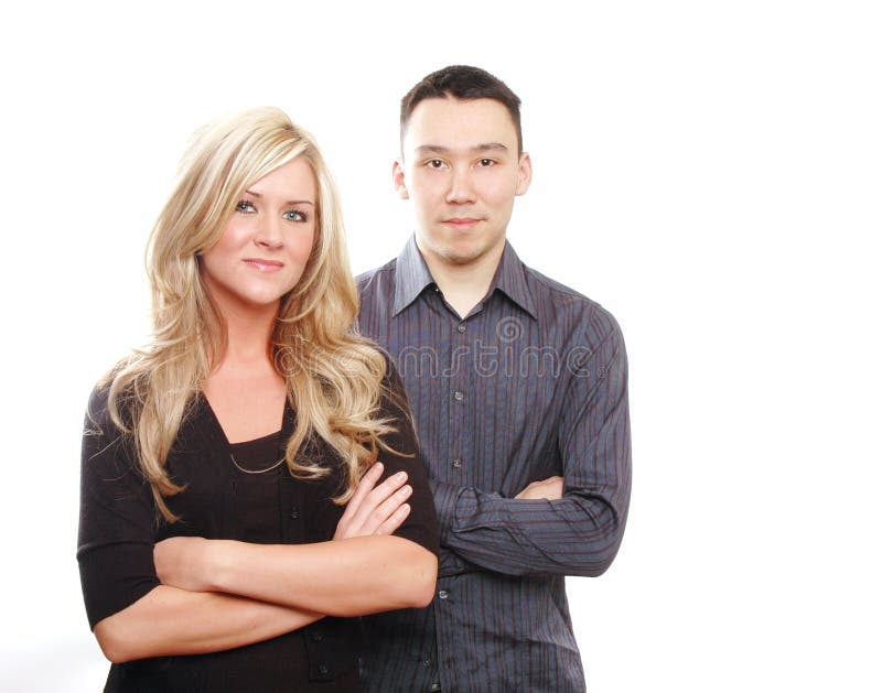 Business partners or couple are posing against white background