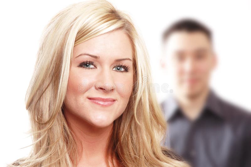 Business partners or couple are posing against white background