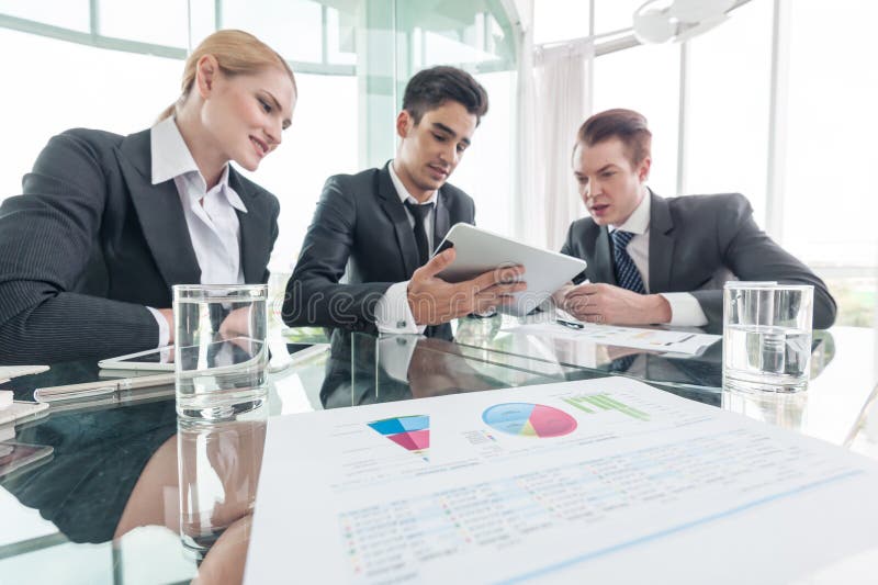 Business partners discussing documents and ideas at meeting royalty free stock photo Business partners discussing documents and ideas at meeting royalty free stock photo