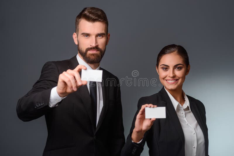 Business partners give visit cards royalty free stock photography Business partners give visit cards royalty free stock photography