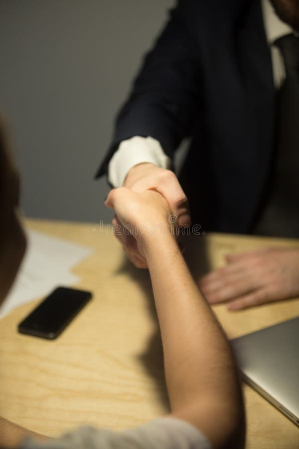 Business partners shaking hands in office royalty free stock photo Business partners shaking hands in office royalty free stock photo