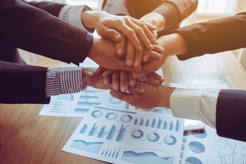 Business partnership large group join hands successful teamwork stock photos