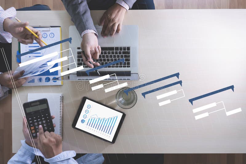 Business People Analyzing PROJECT MANAGEMENT updating Gantt cha royalty free stock photo Business People Analyzing PROJECT MANAGEMENT updating Gantt cha royalty free stock photo