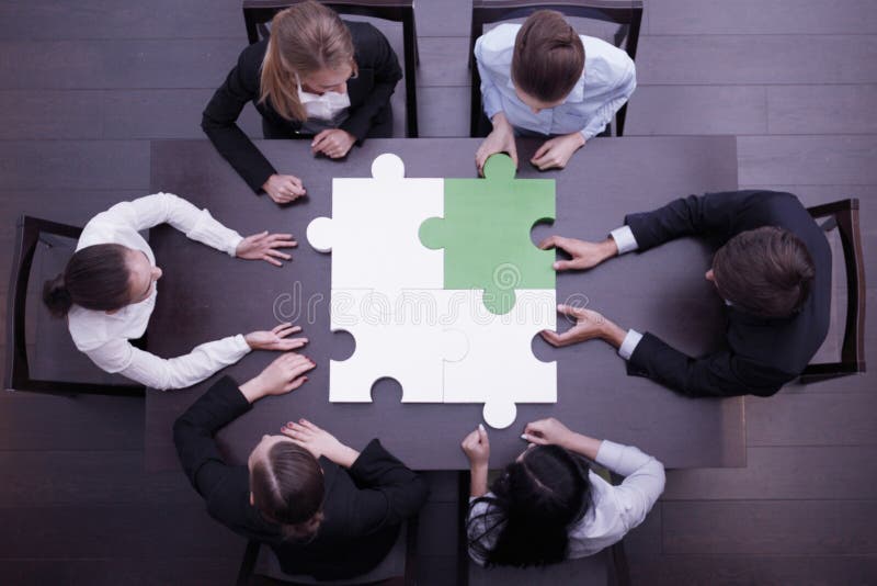 Business people assembling puzzle. Group of business people assembling jigsaw puzzle, team support and help concept royalty free stock photo Business people assembling puzzle. Group of business people assembling jigsaw puzzle, team support and help concept royalty free stock photo