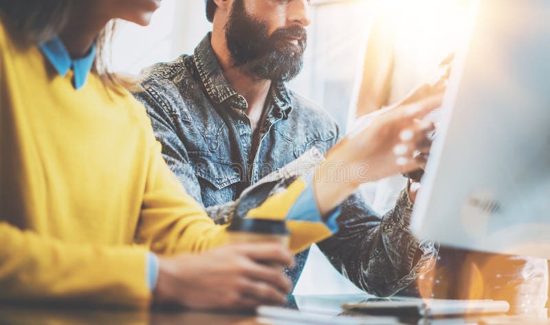 Business people brainstorming concept.Young team of coworkers working together in modern coworking office.Bearded man royalty free stock images Business people brainstorming concept.Young team of coworkers working together in modern coworking office.Bearded man royalty free stock images