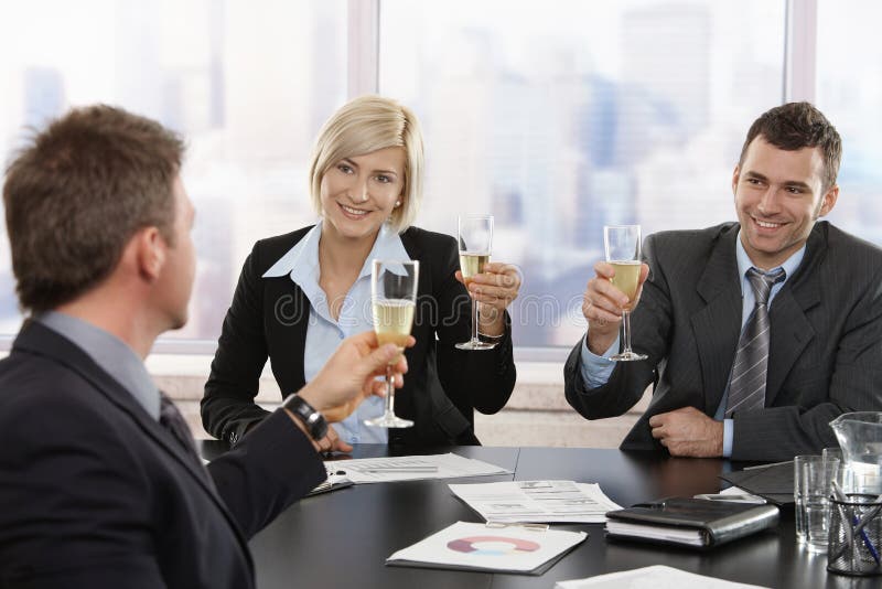 Business people celebrating with champagne