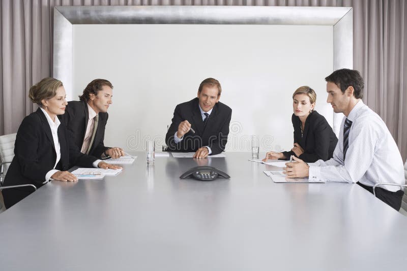 Business People on Conference Call Stock Photo - Image of indoors
