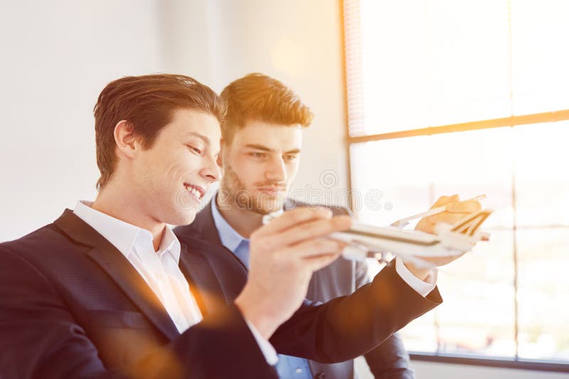 Business people discussing aircraft construction royalty free stock images Business people discussing aircraft construction royalty free stock images