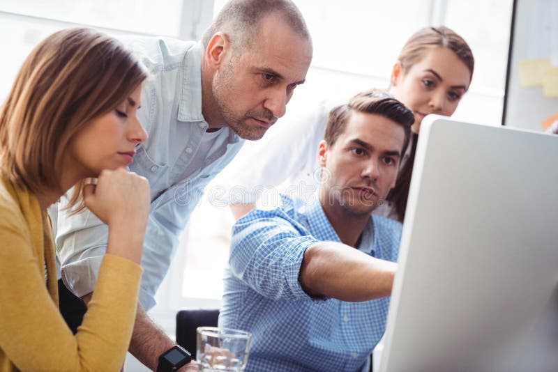 Business People Discussing Using Laptop Stock Image - Image of group