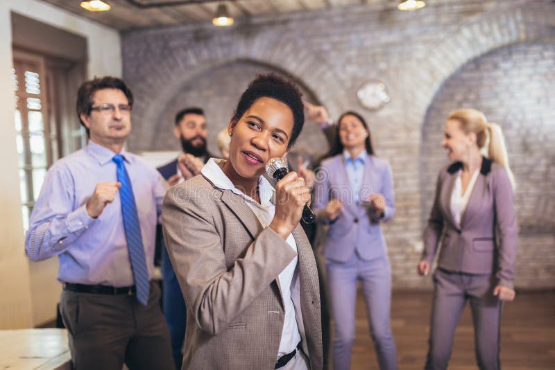 Business People Having Karaoke Party at Coworking Space, Singing