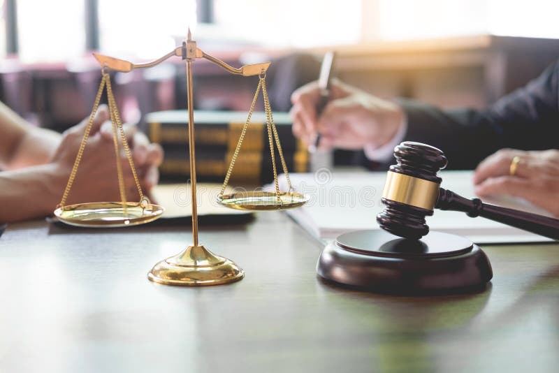 Business people and lawyers discussing contract papers sitting at the table. Concepts of law, advice, legal services stock photography Business people and lawyers discussing contract papers sitting at the table. Concepts of law, advice, legal services stock photography