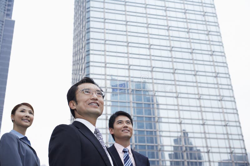 Business People Looking Away In Front Of Building royalty free stock image
