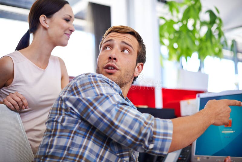Business, people or man with pointing to computer in office for system update, internet glitch or software problem. Web stock image