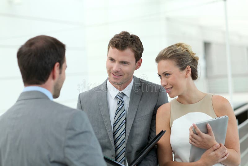 Business People Meeting in Hallway Stock Image Image of corporation, meeting 65070767