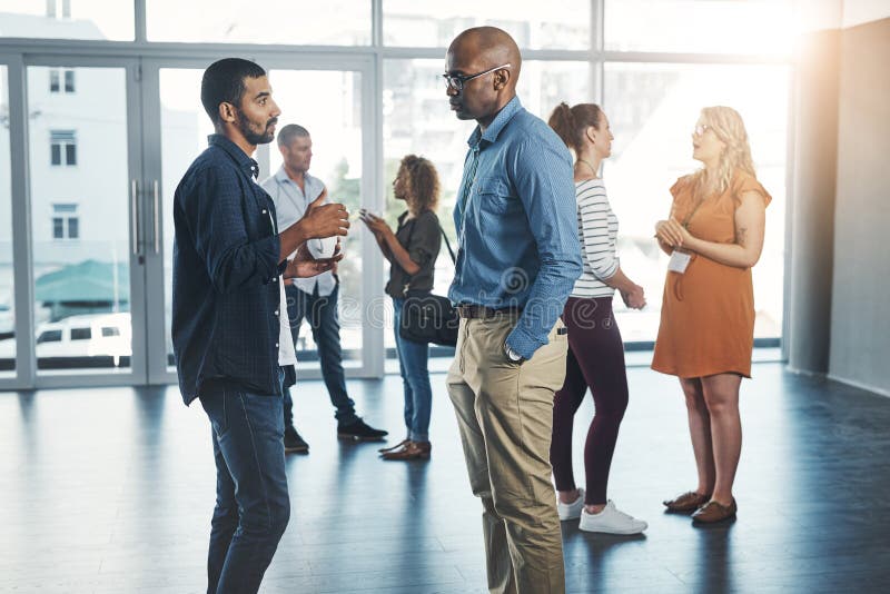 Business people, men and meeting with discussion at workplace for workshop, b2b networking or teamwork. Diversity group royalty free stock image