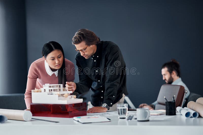 Business people, model and architecture with planning, brainstorming and building renovation ideas. Staff, engineering stock photos