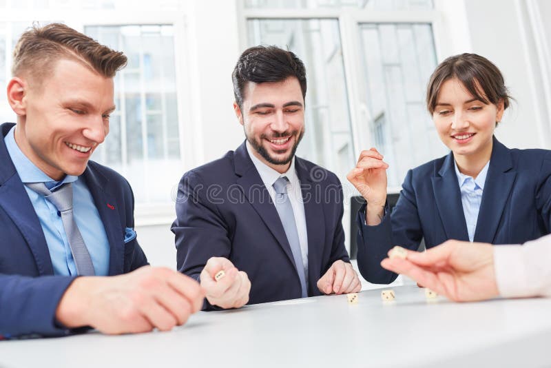 Business people playing dice game stock photo