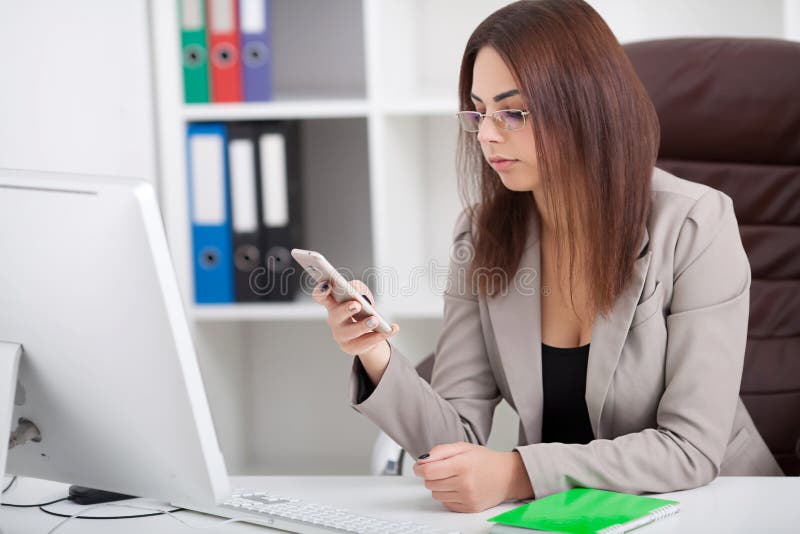 Business People. Portrait Of Woman In Office. Beautiful Confident Smiling Female Worker In Black Top and Gray Suit Sitting In stock images Business People. Portrait Of Woman In Office. Beautiful Confident Smiling Female Worker In Black Top and Gray Suit Sitting In stock images