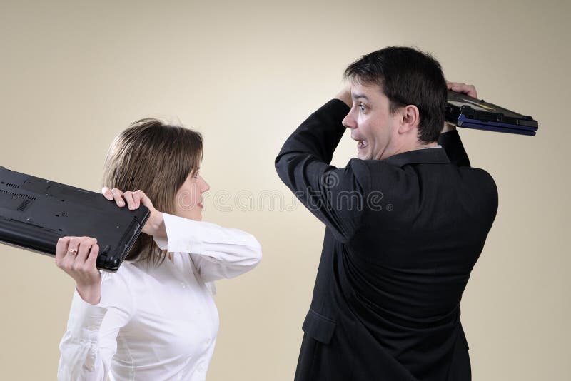 Business people preparing to fight with laptops